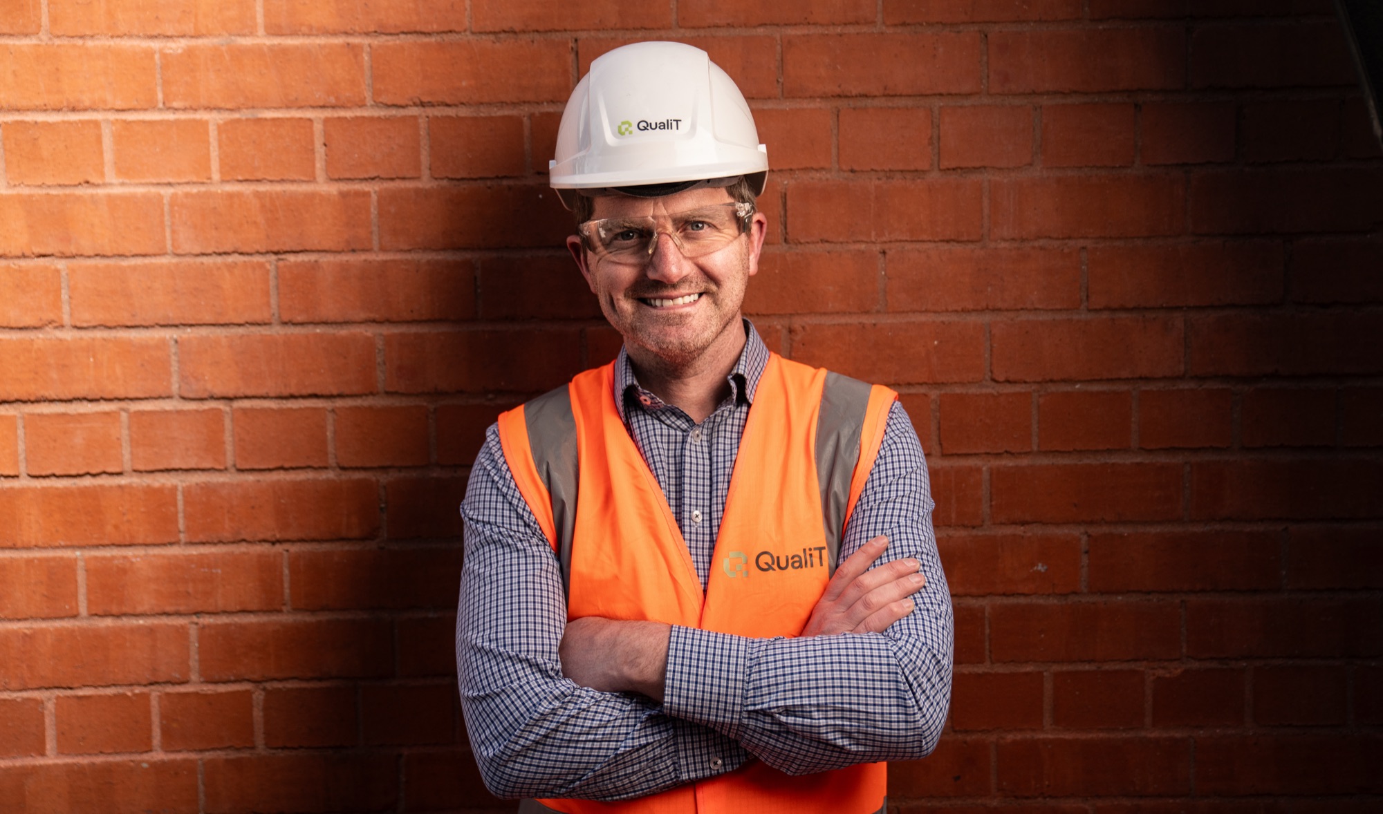 A QualiT-branded construction director on site